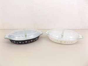 lot 77 image: 2 Vintage Pyrex 1-12 Quart Black Snowflake and Yellow Atomic Starburst Divided Casserole Dishes