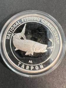 lot 11 image: 1 TROY OZ .999 FINE SILVER NORTH AMERICAN FISHING CLUB ROUND