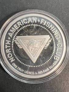 lot 37 image: 1 TROY OZ .999 FINE SILVER NORTH AMERICAN FISHING CLUB ROUND