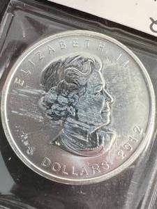 lot 57 image: 1 TROY OZ .999 FINE SILVER 2012 CANADIAN MAPLE LEAF ROUND