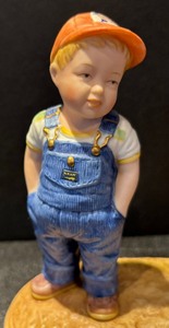 lot 187 image: You Been Farming Long Figurine by Country Store