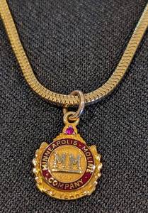 lot 289 image: Gold Filled Tie Clip and 10k Minneapolis Moline Pendant