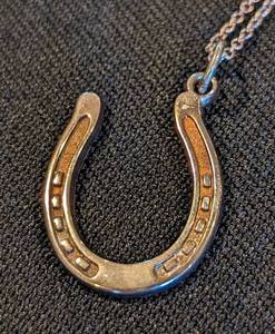lot 291 image: Tiffany and Co. Sterling Silver Horseshoe Pendant and Chain
