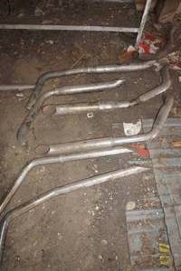 lot 17 image: assortment of Harley Davidson pipes