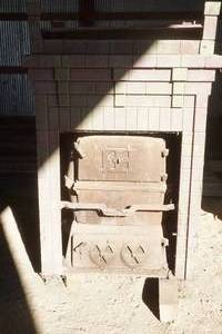 lot 19 image: antique cast iron wood stove