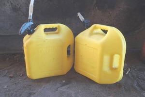 lot 22 image: pair of diesel 5 gal gas cans