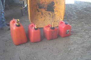 lot 23 image: assortment of 4 gas cans