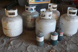 lot 36 image: assortment of new and old style propane tanks 30 lb.