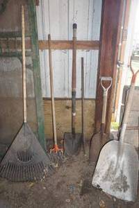lot 46 image: scoop shovel, rake, 2 spades garden weasel, post pounder