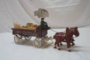 lot 401 image: cast iron horse and produce wagon