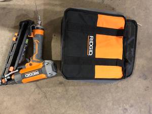 lot 33 image: RIDGID Pneumatic 15-Gauge 2-12 in. Angled Finish Nailer with CLEAN DRIVE Technology, Tool Bag, and Sample Nails Customer Returns See Pictures