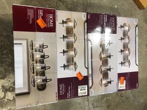 lot 48 image: Lot of Home Decorators Collection Georgina 30 in. 4-Light Weathered Iron Industrial Rustic Vanity with Clear Seeded Glass Shades and Cage Accents   Customer Returns See Pictures
