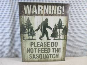 lot 114 image: (FS) Sasquatch Tin Sign - New In Plastic Wrap - 11 12 x 16