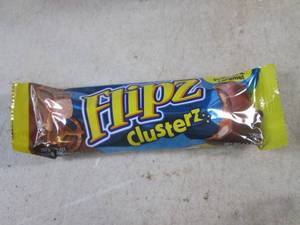 lot 181 image: (B-1) Box of 24 Flipz Clusterz Candy Bars Past Date