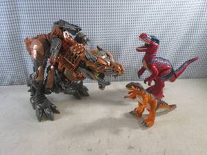 lot 317 image: (G-1) Large Transformer Dinosaur Toy and 2 Other Dinosaur Toys