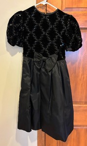 lot 109 image: Fancy Black Childrens Dresses by Jessica McClintock and Sylvia Whyte