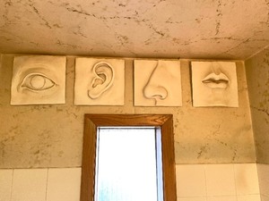 lot 44 image: Set of 4 Sculptural Wall Plaques - Eye Ear Nose Mouth