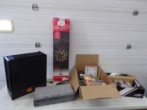 lot 126 image: Food Dehydrator, VHS Player, VHS and DVD Movies and Cassettes