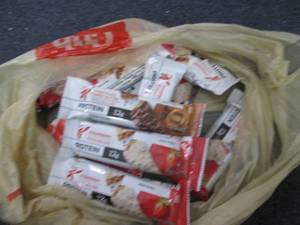 lot 129 image: 12 Keloggs Protein Bars...