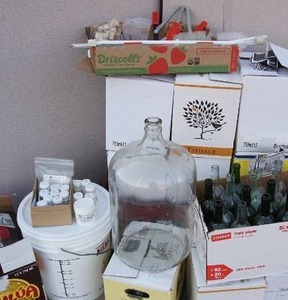 lot 33 image: Home Brewing Fruit Wine Making Tools Equipment Supplies Including but not Limited to Double Lever Re-Corking Machine, CarBoy, Bucket, Bottles, Corks, Cleaners Etc.