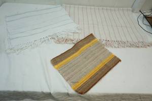 lot 157 image: 2 Light Colored Rag Rugs with a place mat