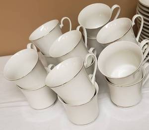 lot 137 image: Tea for Sixteen - White with Gold Trim Tea Cups and Saucers.