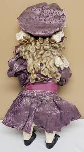 lot 161 image: Antique Bisque Doll with Plum Dress and Bonnet