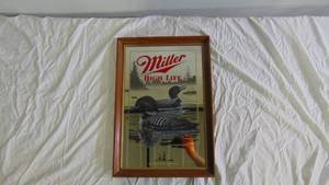 lot 59 image: Miller High Life Loon Mirror Wall Decor - 22 14 x 15 14