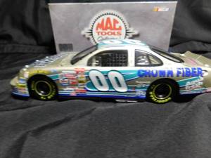 lot 228 image: 1999 Mac Tools Buckshot jones #00 Crown Fiber Pontiac 124 scale die cast Nascar