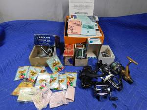 lot 257 image: Fishing reels, fishlip jigs, and walleye and crappie tackle and vintage regulation books
