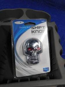 lot 287 image: Skull shifter topper, jumper cables, center cup holder