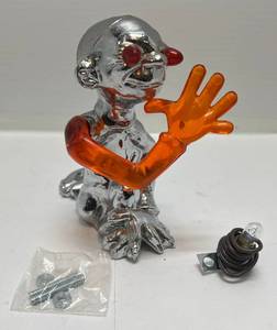 lot 205 image: 1970s JC Whitney Catalog Item Jester Light Up Hood Ornament (Arm And Eyes Light Up 5 12T x 4 12D x 3W (VERY COOL) (Never Installed)