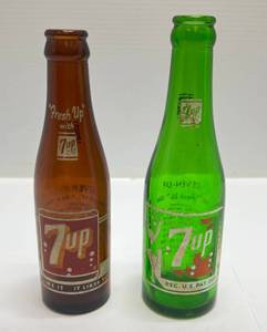 lot 219 image: 1950s Brown Amber 7Up Bottle 7 34 & Green Vintage 7Up Bottle 8