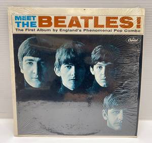 lot 258 image: VIntage Meet The Beatles Vinyl LP  (Record In Plastic Sleeve)