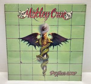 lot 260 image: Vintage Motley Crue Dr. Feel Good LP (Factory Sealed)