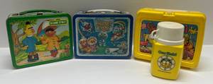 lot 278 image: Three Vintage Lunch Boxes Including Sesame Street, Muppet Babies (No Thermos) & Plastic Garfield (With Thermos)