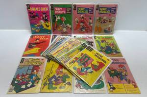 lot 313 image: Misc. Comics Including 15, 20 ,25, 35, 40, 50 Cent Walt Disneys And More (In Protecive Sleeves On Card)