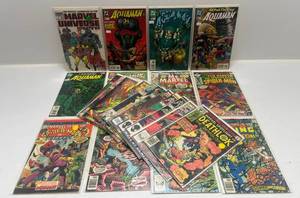 lot 315 image: Misc. Comics Including Aquaman And More (In Protecive Sleeves On Card)