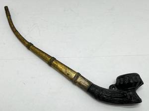 lot 76 image: 19th20th Century Thai Opium Pipe, With Molded Clay Bowl And A Banded Metal Stem, 8 Long
