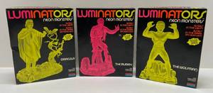 lot 115 image: 1991 Monogram Universal City Studios Luminators Neon Monsters Model Kits The Wolfman, The Mummy Partially Assembled & Dracula Opened And Not Assembled
