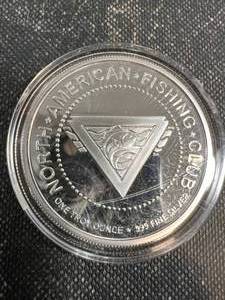 1 TROY OZ .999 FINE SILVER NORTH AMERICAN FISHING CLUB ROUND IN AIRTITE