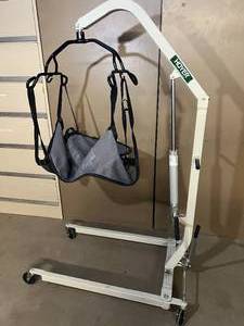 lot 11 image: Hoyer Haudraulic Patient Lift Hydraulic Bedside with Sling On Wheels - Many Uses For This Powerful Lift - Mechanics, Veterinary Clinics, Etc.