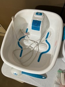lot 50 image: HoMedics Double Insulated Bubbling Foot Spa including Ped Egg with Handle and Mary Kay Pedicure Set (Foot Soak, Foot Balm, Brush, and Bag) - Good Working Condition