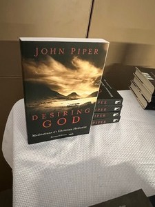 lot 54 image: Collection of NEW John Piper Christian Books (Desiring God, Expository Exultation, Andrew Fuller, and Let The Nations Be Glad)