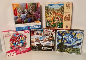 lot 262 image: 18 Puzzles by Ceaco, Disney, Re Marks, Polaroid and More