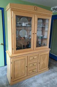 lot 7 image: Ashley Furniture Blonde Wood Display Cabinet