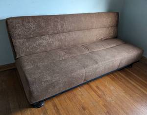 lot 314 image: Brown Pull Out Futon Style Sofa