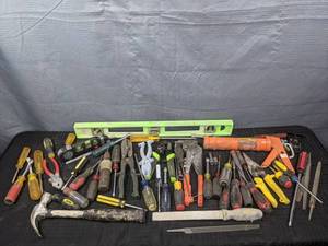A Variety of Tools Including a Level, Caulk Gun, Screwdrivers, Pliers and More