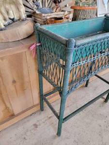 lot 19 image: Miscellaneous Lot Animal statuesfigures. Wicker Plant Stand. Wolves. Deer. Quaker Tree Stump. Glass topped Table.