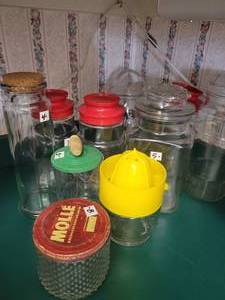 lot 46 image: Lot of Kitchen Misc  Espresso Machine. Smiley Face Cups. Tea and Coffee Pots. Dishes. Bowls. Containers. Etc. Etc.